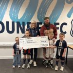 Juan Two Three Dark Blues Make £300 Donation in Support of Academy